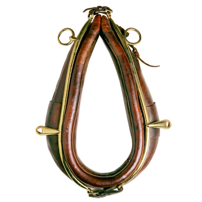 Victorian English leather horse collar with brass rings.  Traditionally used for heavy pulling by wagon or plow.  Great for wall decoration!