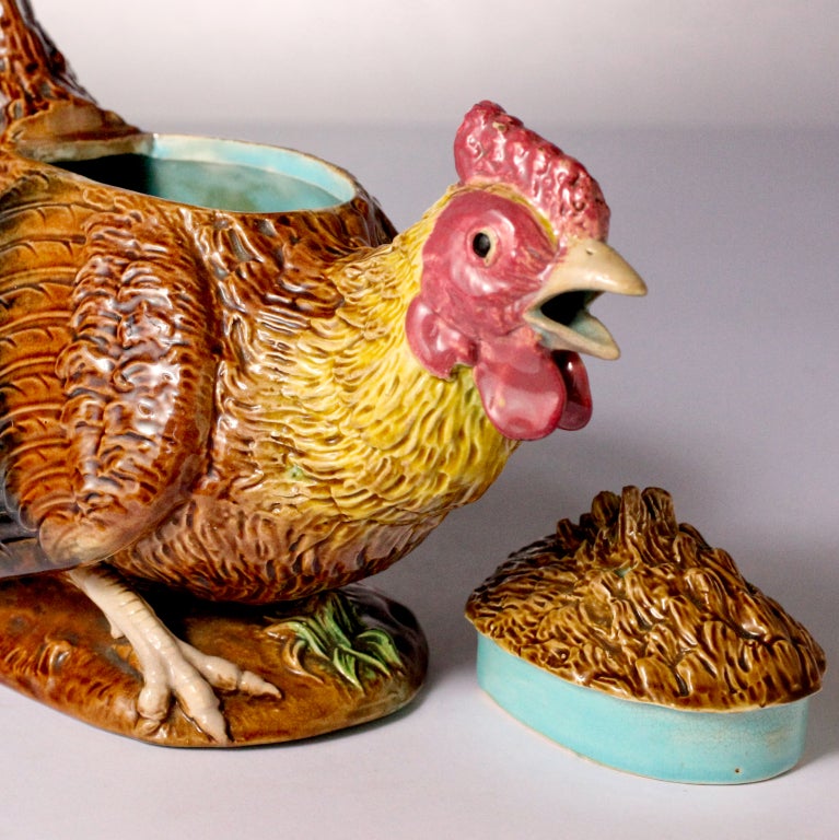 Rare George Jones majolica teapot shaped like a crowing cockerel. Whimsical English design with realistic feathered lid, curved tail handle and rooster head with open beak through which the tea pours. Impressed: G. J. Pattern No: 3203.