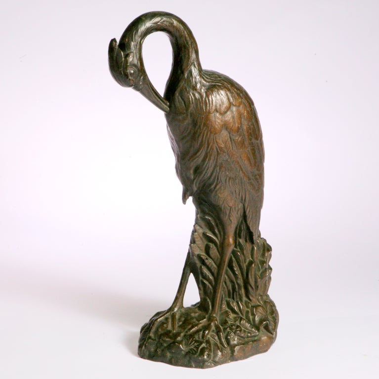 'pair of bronze herons in brown sculptures'