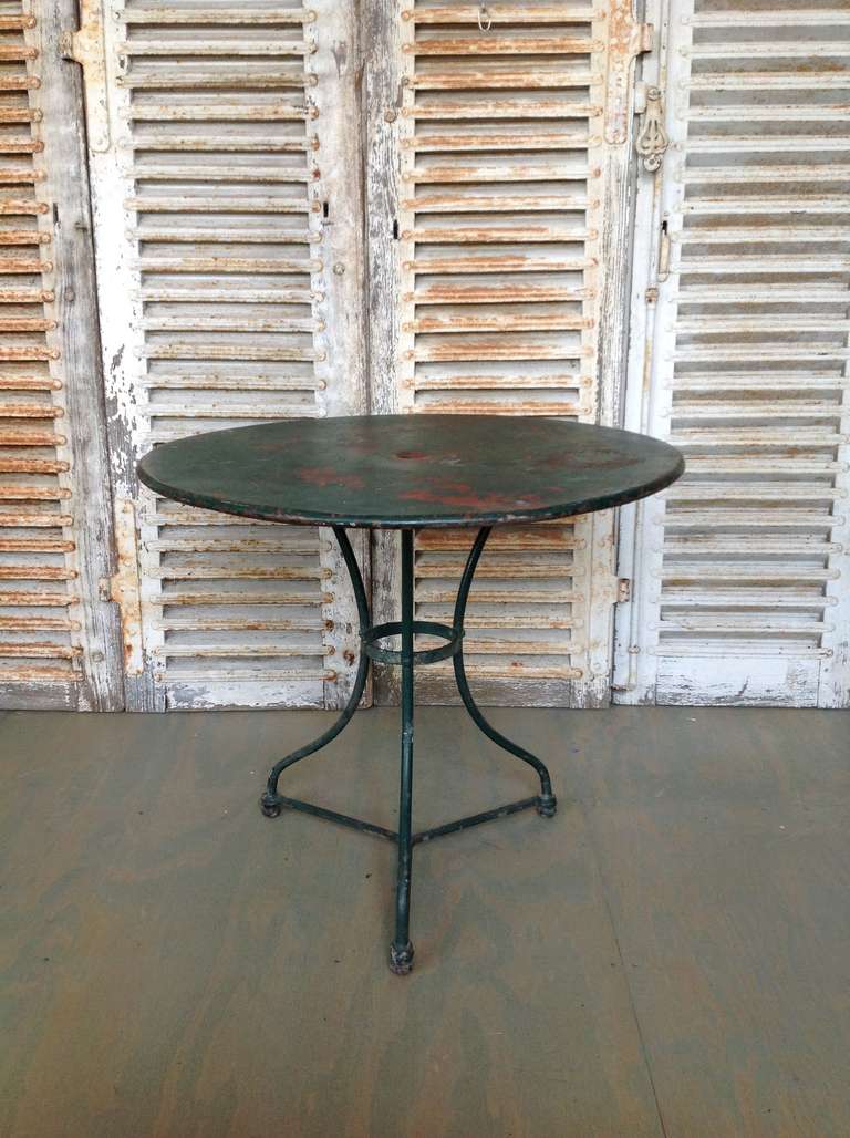 19th century French iron garden table with distressed green paint.  This price of this item has been reduced. This is the final net price.

Sold as is.