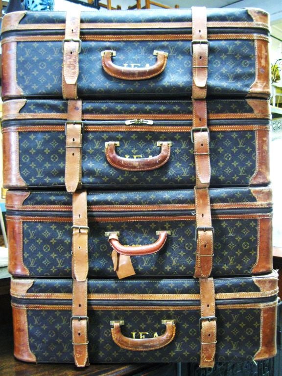 Always chic, set of 4 vintage Louis Vuitton Suitcases, with straps all around. Usued a decorative accents, these are hot! Can be sued as is for the travel extraordinaire. Made into side or coffee tables, even ottomans and poufs, we always love one
