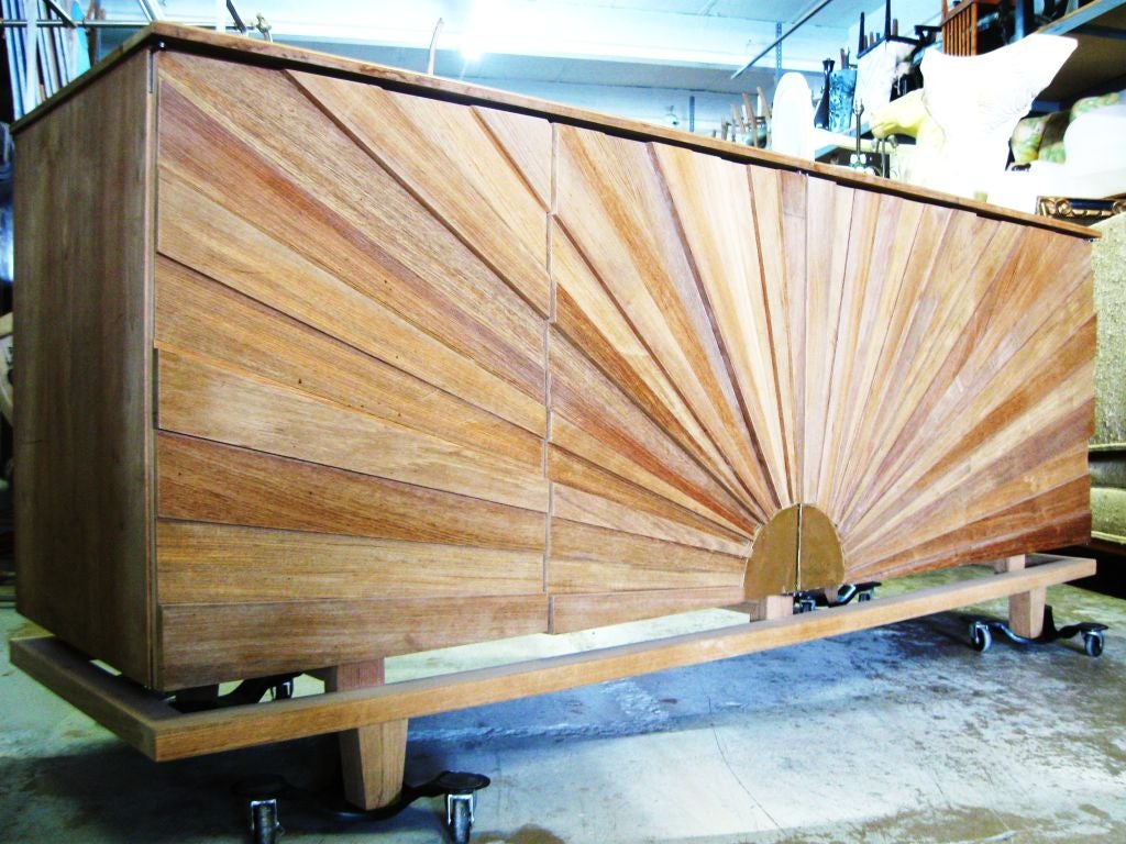 Spectacular large 4 door Sunburst front sideboard, with bold decoupage sunrays, on a superb tressel base, top floats, all natural wood, teak, custom made to spec for client, by R. Mapache. Exceptionel cabinery, combines beautifully with Mid Century