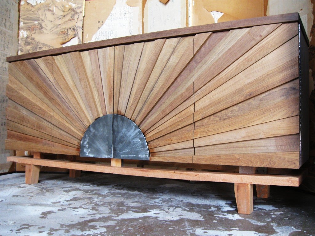 Spectacular large 4 door Sunburst front sideboard, with bold decoupage sunrays, on a superb tressel base, top floats, all natural wood, teak, custom made, by R. Mapache,for Sabina Danenberg Atelier,limited edition of 10.
Exceptionel cabinery,
