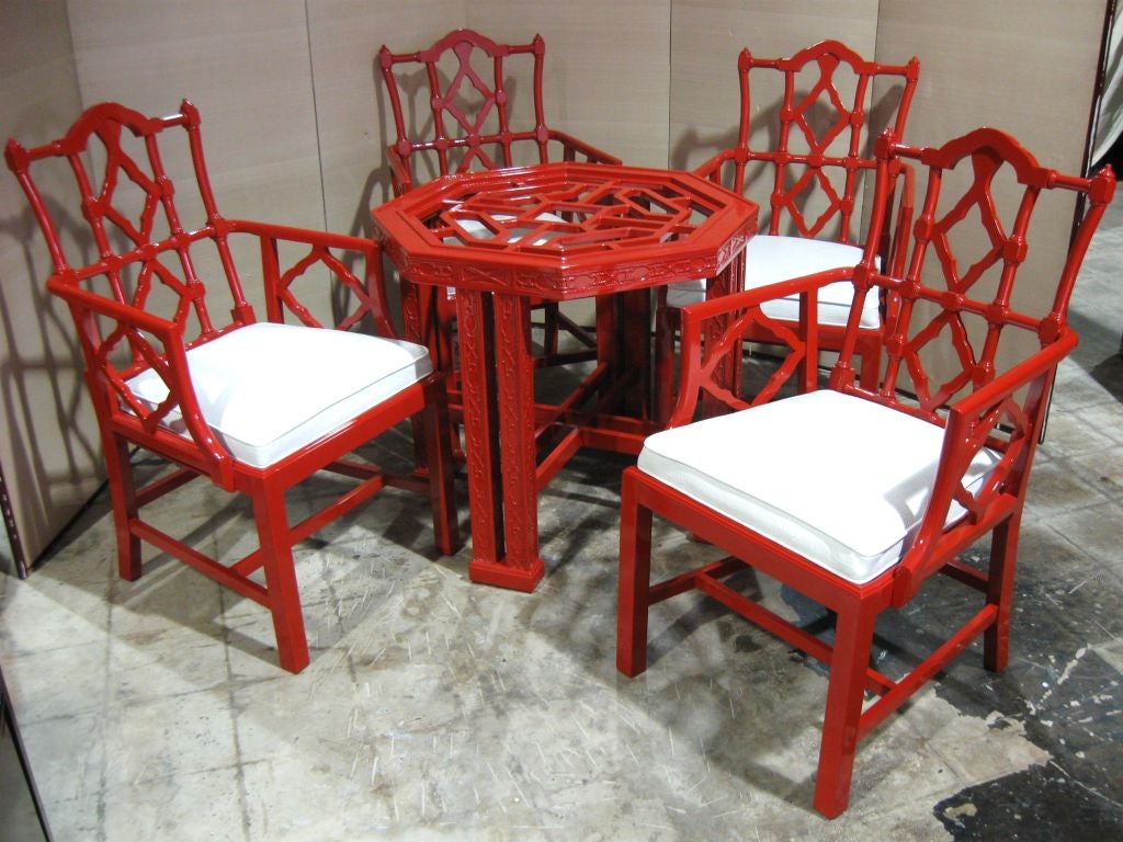 Elegant 5 piece chinese chippendale inspired table and armchairs, lacquered in a rich chinese chippendales style red, with superb white faux croc uphol. Wonderful in a dining room, den, or kitchen area. Combines beautifully with mide century or