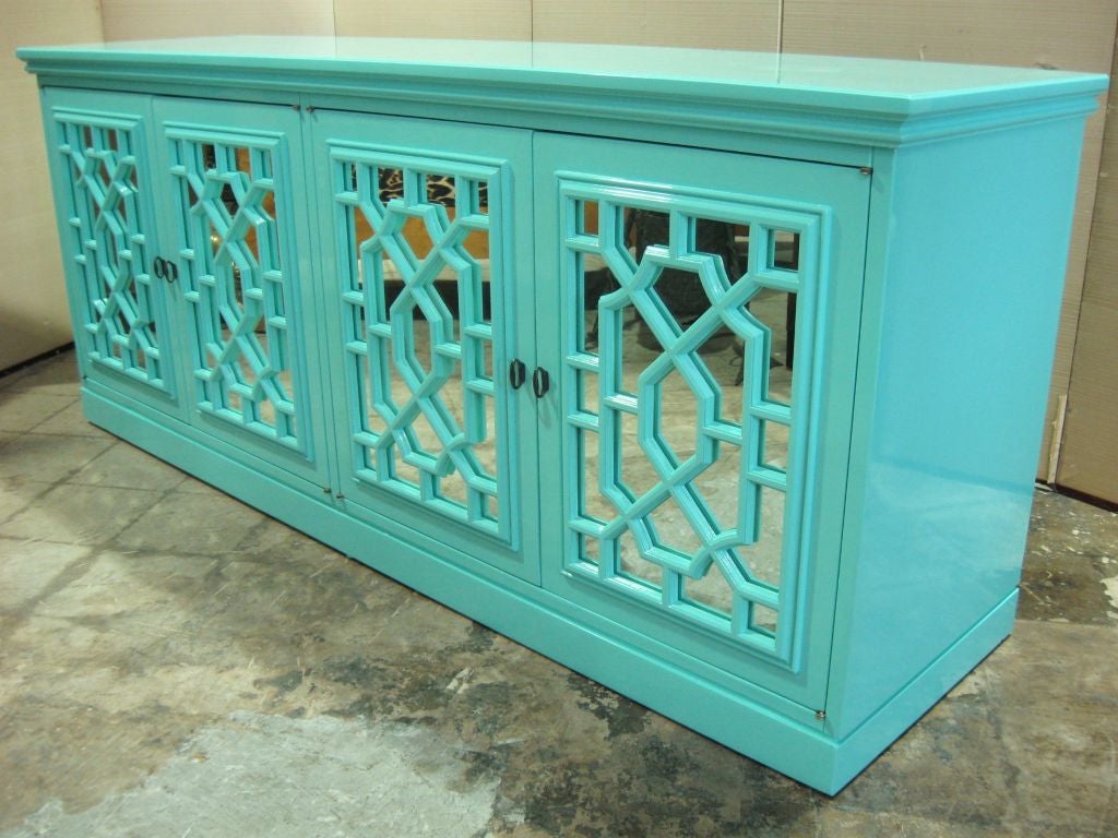 Superb Lacquered Chinese chippendale style cabinet, sideboard, bureau, console, credenza. Elegant lattice front doors backed with mirror. Rich tropicana cabana high gloss finish. Wonderful for a living room, dining room or bedroom.