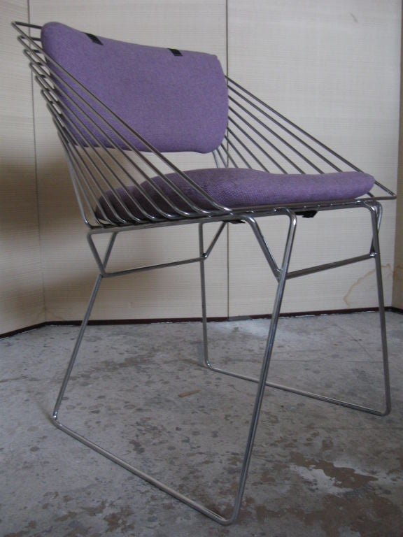 Set of six chrome wire frame dining chairs, very much in the style of W. Platner. Elegant side details at arm, tight frames, good condition, comfortable seating. Wonderful with mid century tables and sideboards.