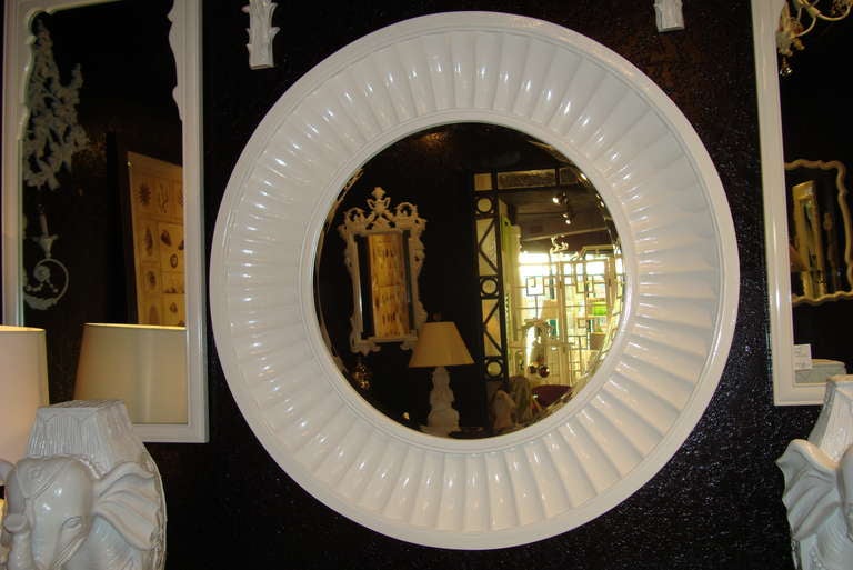 Hollywood Regency style lacquered mirror with contour border.