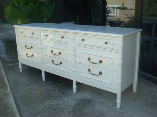 Newly Lacquered High Gloss White Nine Drawer Dresser <br />
Brass Pulls.Palm Beach Revival.