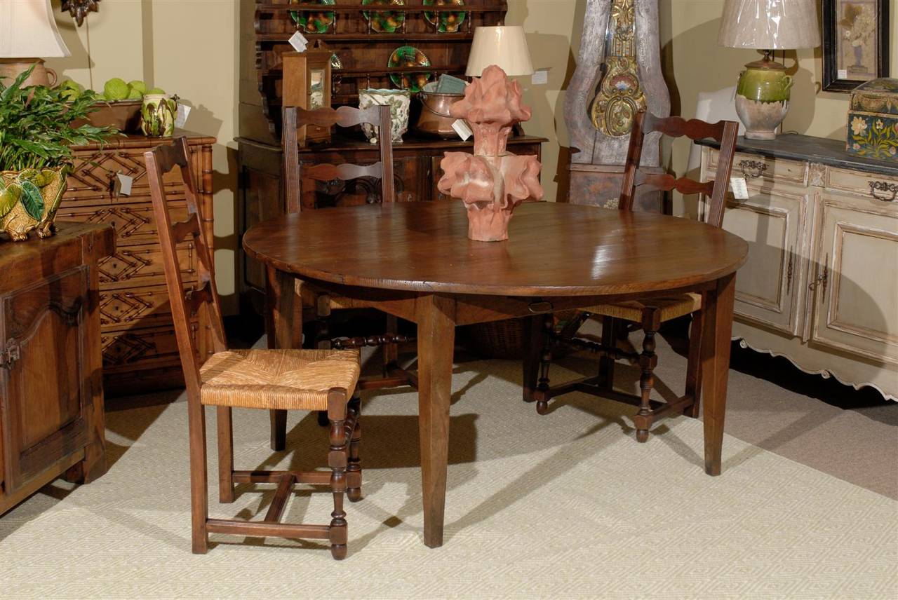 We are always looking for round tables.  Our clients love dining on a round table.  This is a drop leaf so it offers versatility as well.  The table is 63