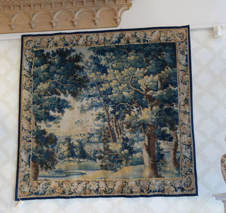 :This Brussels tapestry is very fine quality made possible by the use of both silk and wool in its weaving. The overall effect is a smooth surface as contrasted to the thick, knotty texture of an Aubusson.

It has the original border which is also