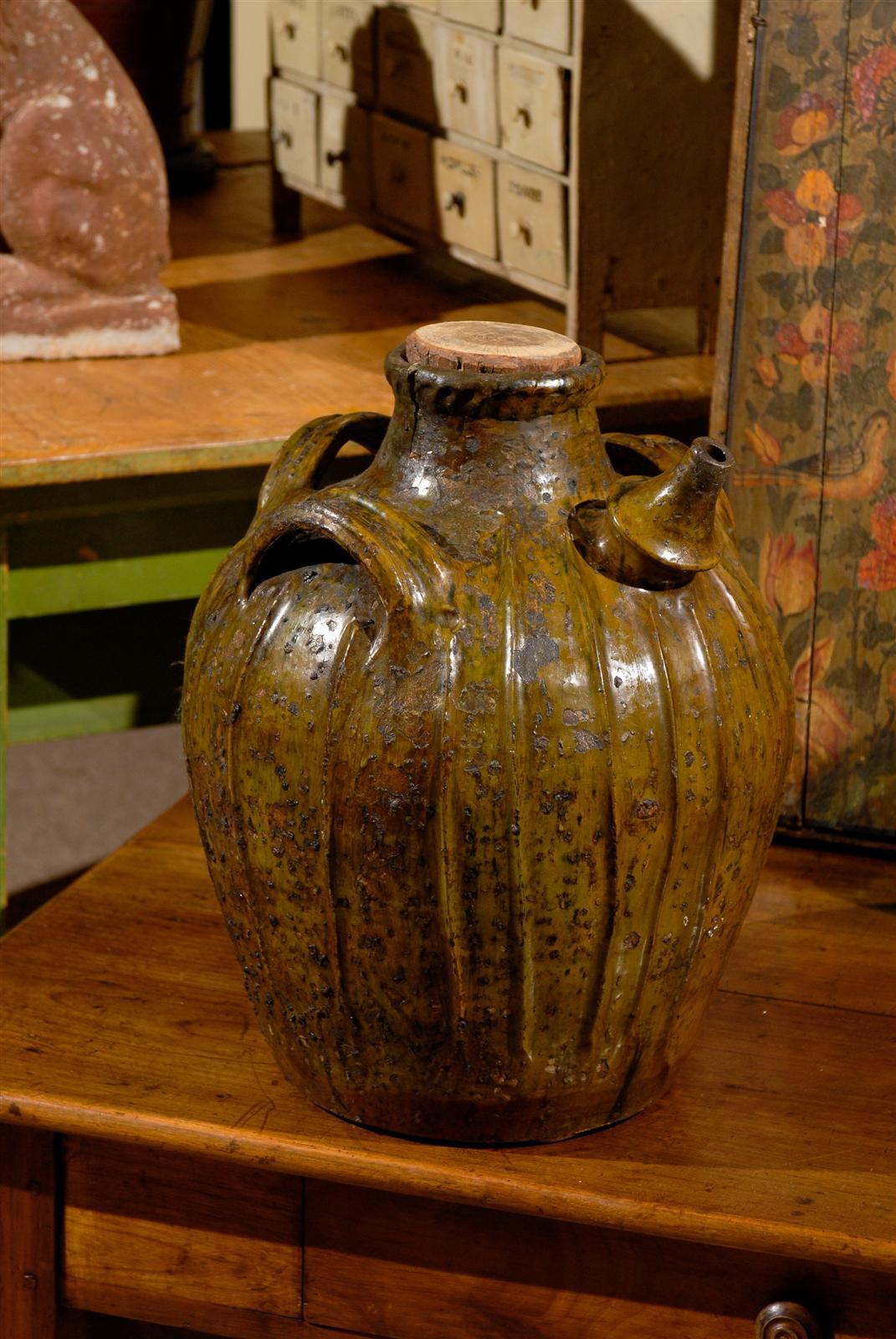 19th Century Terracotta Oil Pot from France, Circa 1860
The colors on these wonderful old oil pots are always beautiful earth tone shades with hints of green.  This one comes from Auvergne, a rural, mountainous region in central France. The very old