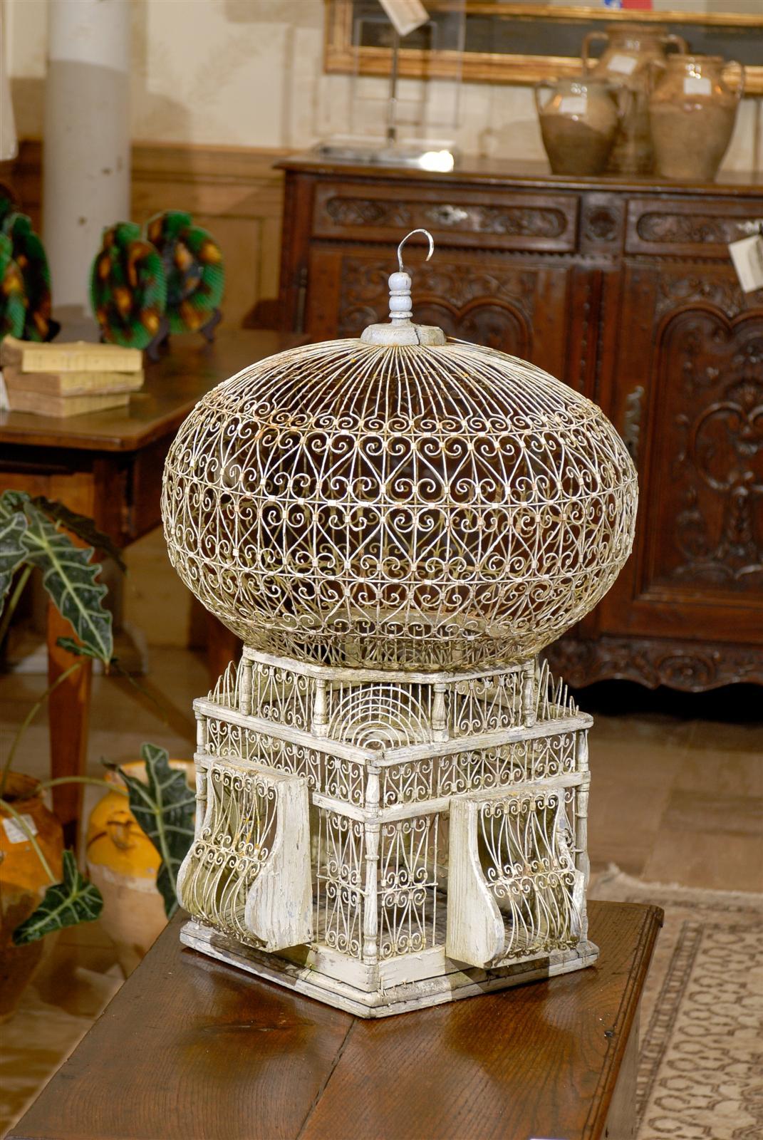   Vintage White French Birdcage, Circa 1910
This is charming painted birdcage from Tunisia which we happened to find at an antiques fair outside of Paris.  It has a great shape and dates from the early part of the 20th century, circa 1910-1915.  It