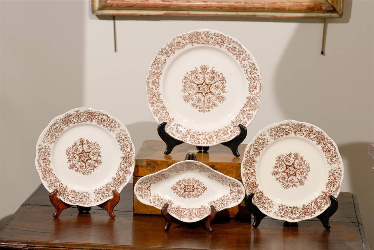 Vintage Set of Longchamps China, Circa 1950
A 16 piece set of Longchamps china from the Bella Collection.  Colors are brown on cream and we have 12 dinner plates measuring 9.75