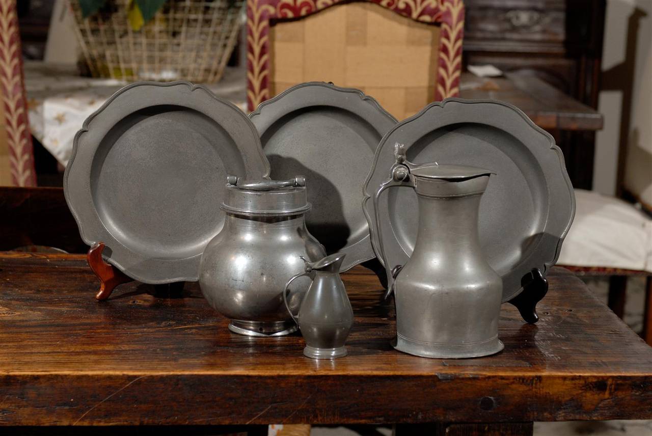 We have put together is collection of pewter some of which comes from Bruges, Belgium and the pitchers come from France. All pieces can be priced separately:
 The plates  are a set of 3 and measure 9.5