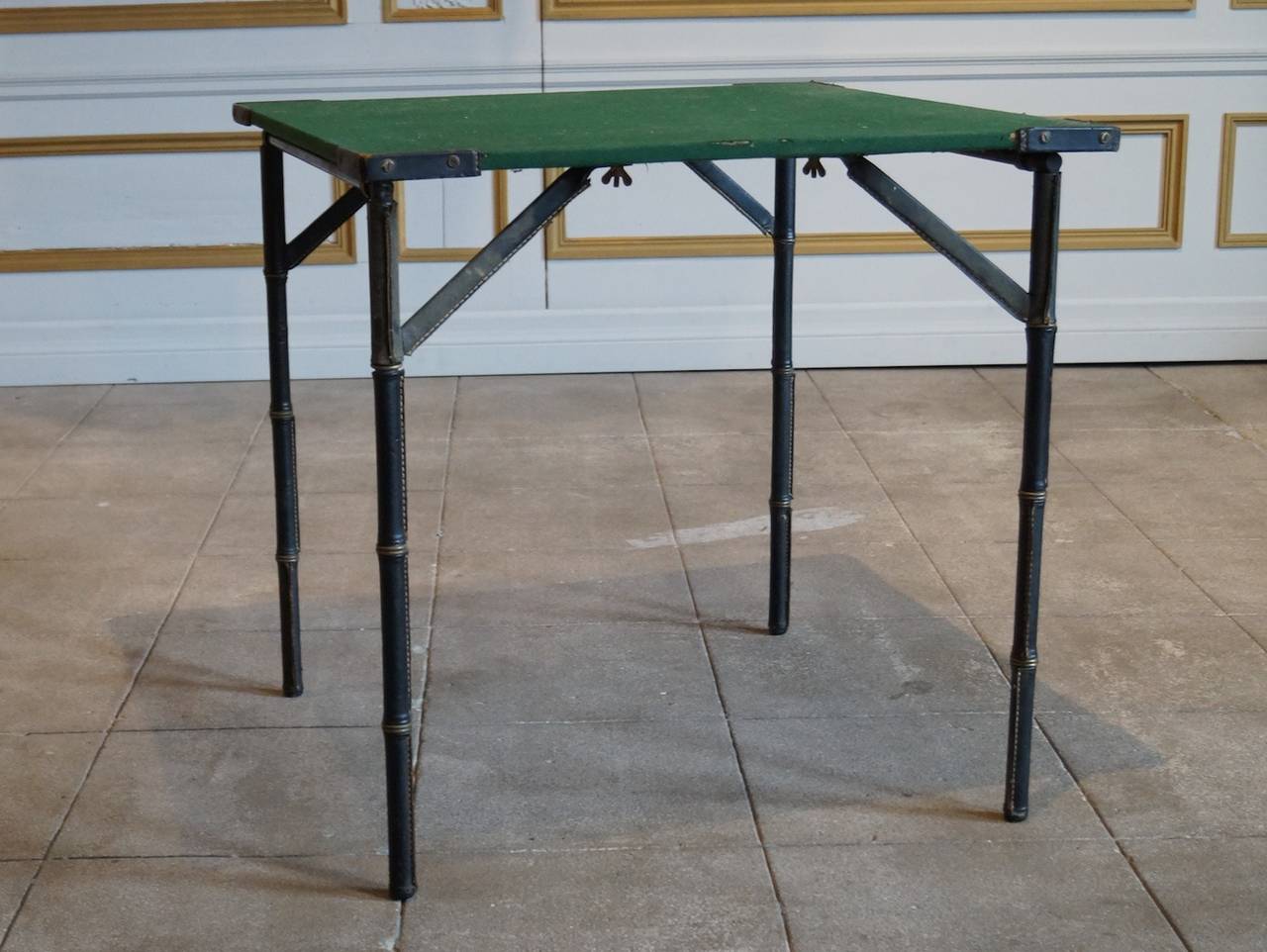Pure Classic Jacques Adnet game or card table in hand-stitched leather with felt top. French architect Jacques Adnet (1900-1984) worked for Maurice Dufrêne before establishing himself as a successful designer, operating in an elegant but