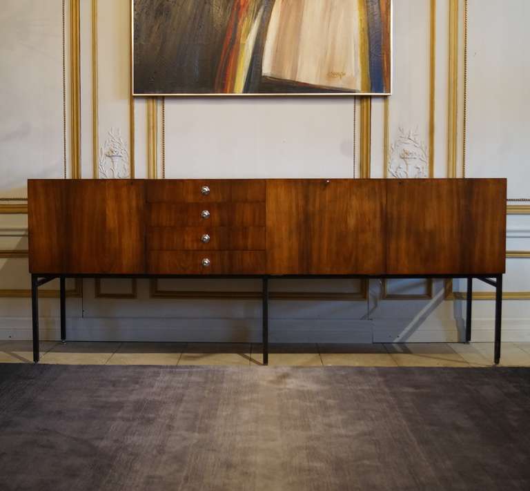 Rosewood veneer on solid oak sub-straight, lacquered steel and chromed metal sideboard 800 designed by Alain Richard for Meubles tv, 1958. An identical example is featured in the collection of the Musee des Arts Decoratifs in Paris.