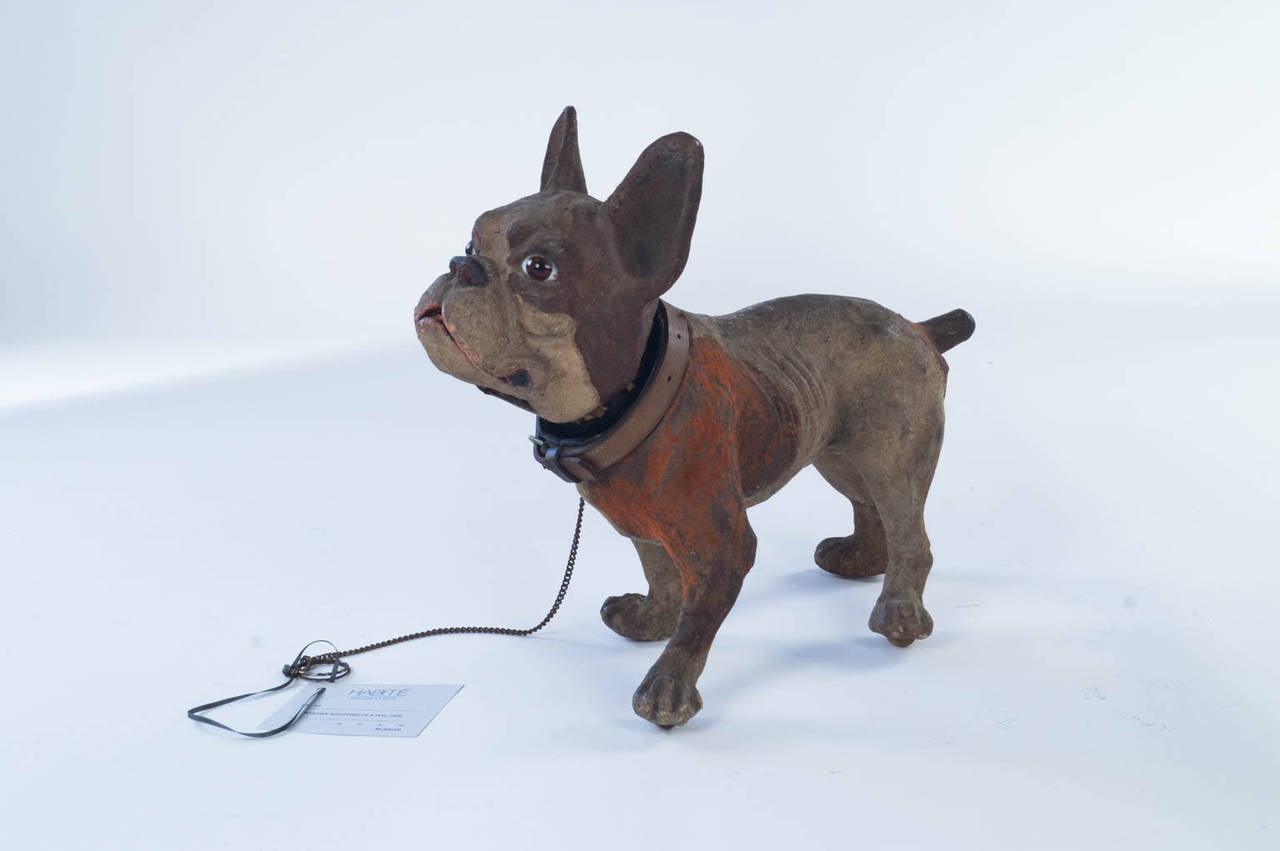 Papier mâché sculpture of a dog with glass eyes, 1920, France.
The mouth opens when the chain is pulled.