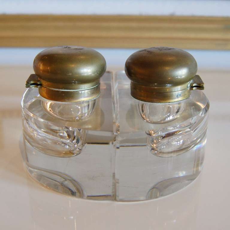 Pair of half circle glass and brass ink wells forming a circle, USA, 1960's.