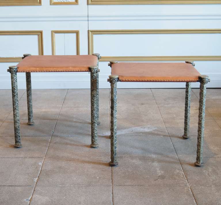 This is an elegant pair of iron and hand stitched saddle leather stools by sculptor Ilana Goor.