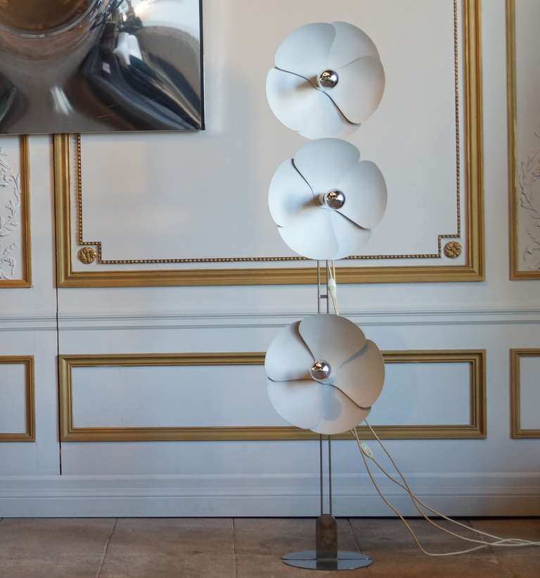This is a rare three light metal floor lamp designed by Olivier Mourgue.