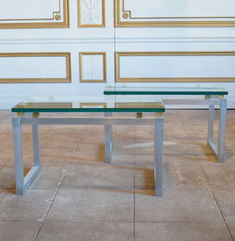 Elegant pair of glass side tables from France 1970s, in brushed aluminum and brass.