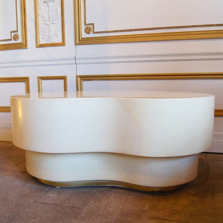 Cream Lacquered Kidney Shaped Coffee Table in the style of  Karl Springer. This table has been restored.