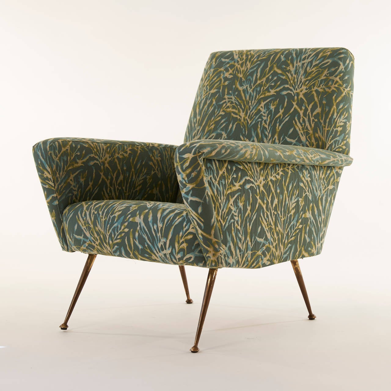 This elegant pair of armchairs with brass legs has been reupholstered in a whimsical Rubelli 