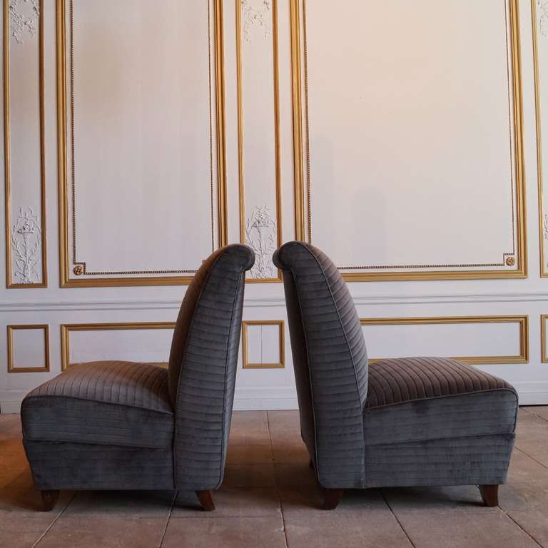 This beautiful and comfortable pair of Eugene Schoen slipper chairs has been reupholstered and are incredibly well made. Reupholstered in a luscious Sacho velour fabric (Tasso) with an elegant horizontal, broad rib.