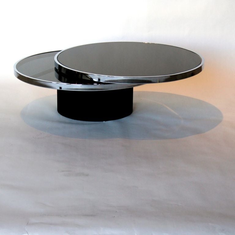 ITALIAN 1970's SWIVELING BLACK GLASS TOP  & CHROME COFFEE TABLE IN THE STYLE OF WILLY RIZZO.