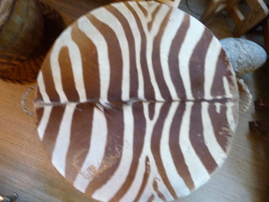 Vintage Zebra Covered Drum Table. Sides Are Wrapped With Raffia. On Three Zebra Covered Legs