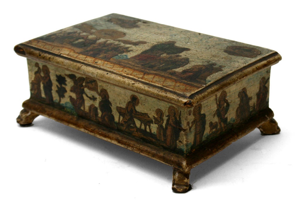 This small Venetian gem has lacca povera decoration which is the Italians version of decoupage. It is hand-painted and lacquered with cut-outs of various saints. A beautiful aged box that would be appropriate on either a desk or side table.
Lacca