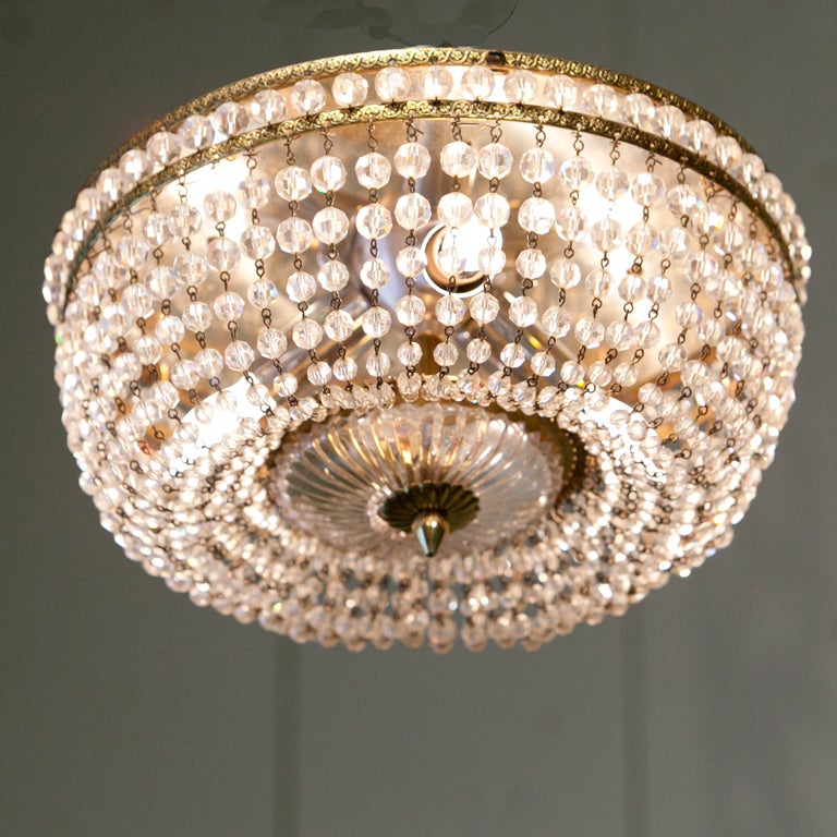 Beautiful Italian flush mount fixture with graduated crystal beads.  Three internal lights, which have been newly wired in the US.