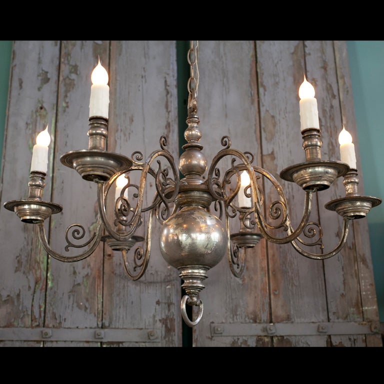 Nickel plate over brass. This light is beautifully proportioned and of nice heavy casting. Circa 1930s, this light has been re-wired in the United States.