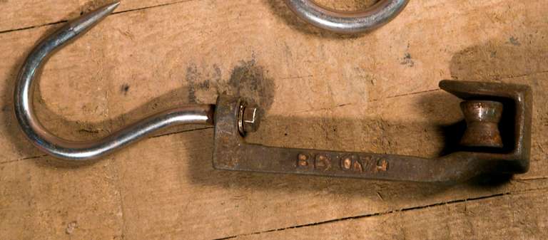 Aluminum and iron butcher's hooks dating from the 1950s. Heavy and solid.