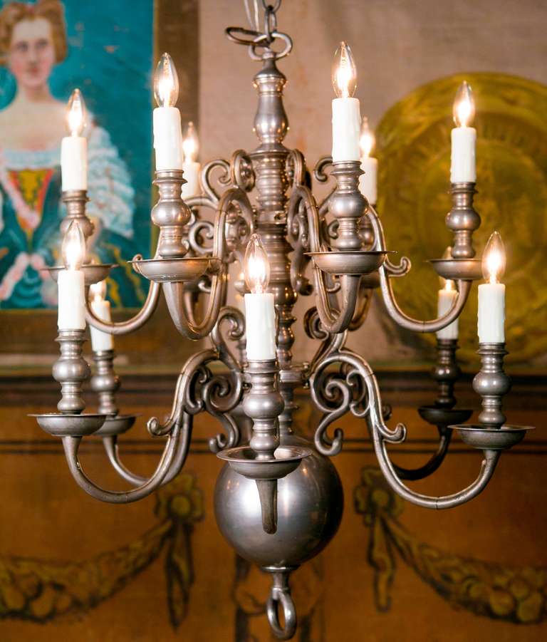 This Dutch two level chandelier is of wonderful quality. Made and re-wired for the USA with candelabra sockets. It is nice and heavy and we believe old nickel plate over bronze.  It is a pewter look but not as soft as pewter.