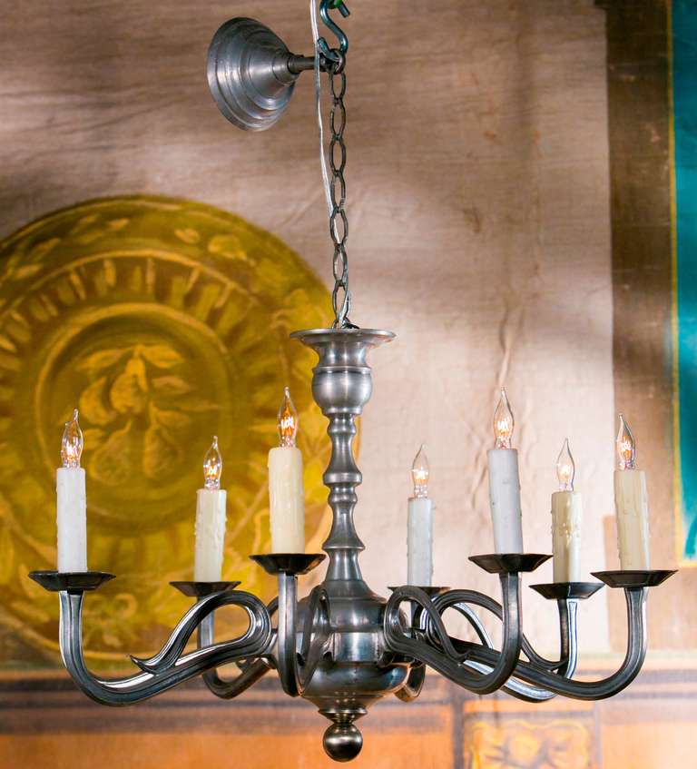 Art Nouveau-style pewter chandelier with eight arms, circa 1940. Vintage polished pewter French chandelier newly wired for use within the USA with eight candelabra sockets and all UL listed parts. Likely dates from the 1940's. Simple but elegant