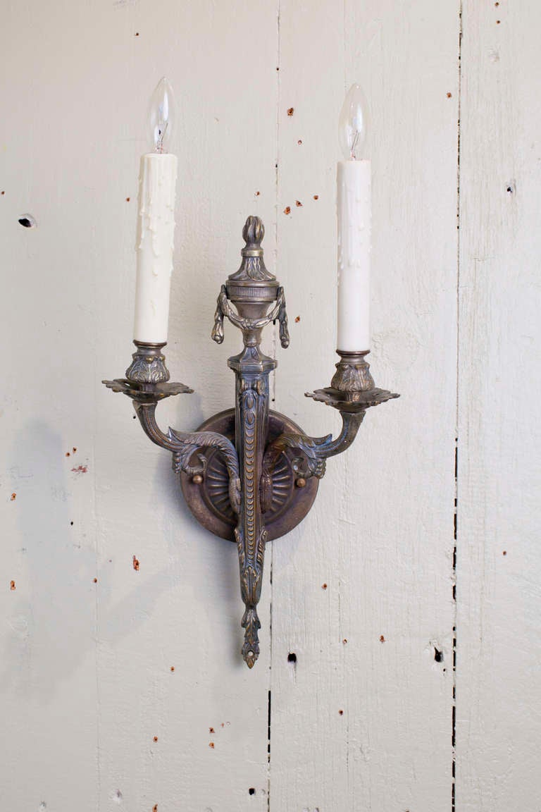 Cast Pair French Two-Arm Empire-Style Bronze Sconces with Urn and Swag Detail For Sale