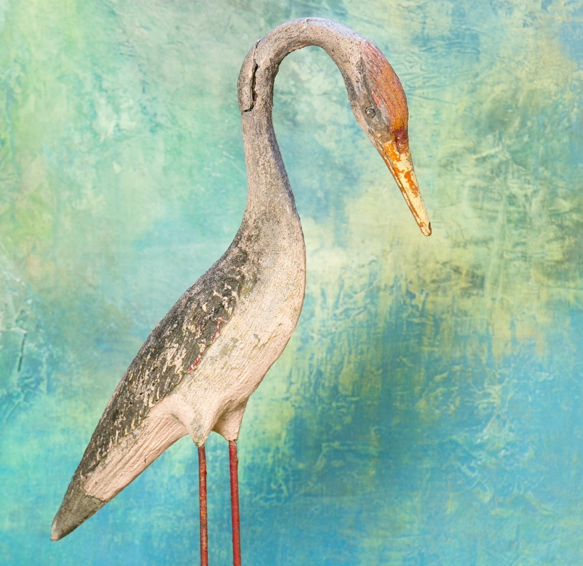 Cement sculpture of shorebird, most likely a heron. Body of the heron is reinforced concrete. Legs are made from iron. Hand-sculpted and hand painted. From France circa 1950's.  There is small damage to the neck.