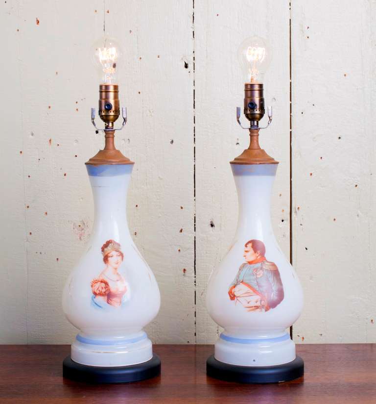 Pair of French hand-blown milk glass table lamps with the figures of Napoleon and Josephine hand-painted on them. From France, circa 1890.
Newly wired in the United States, mounted on new bases. One single Edison socket per lamp.
Color is less