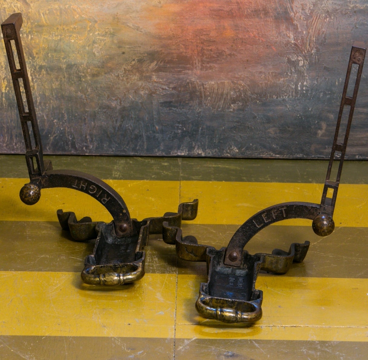 A truly unusual and unique item. Heavy cast bronze andirons in the Arts & Crafts style. Unlike anything we have ever found in Europe.  circa 1930s. Solidly and expertly made. Measurement listed is for one. Sold together as a pair for $1,100.