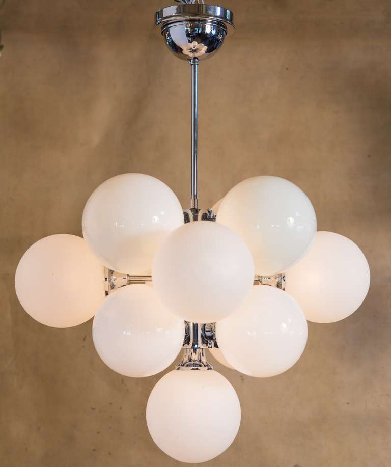 Unique style of Mid-Century Modern pendant. Handblown globes with chrome body. Thirteen globes in total alternate between matte and glossy texture.