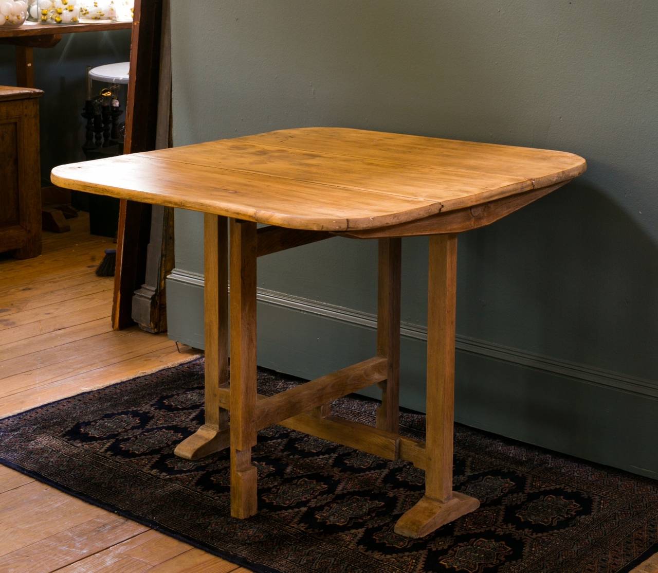 Handmade vintage wooden folding table from France, circa 1920s in working order.