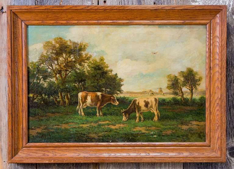 Vintage original painting of two cows grazing. Wooden frame. Painting is in good condition with one small nick (see top right of picture two).