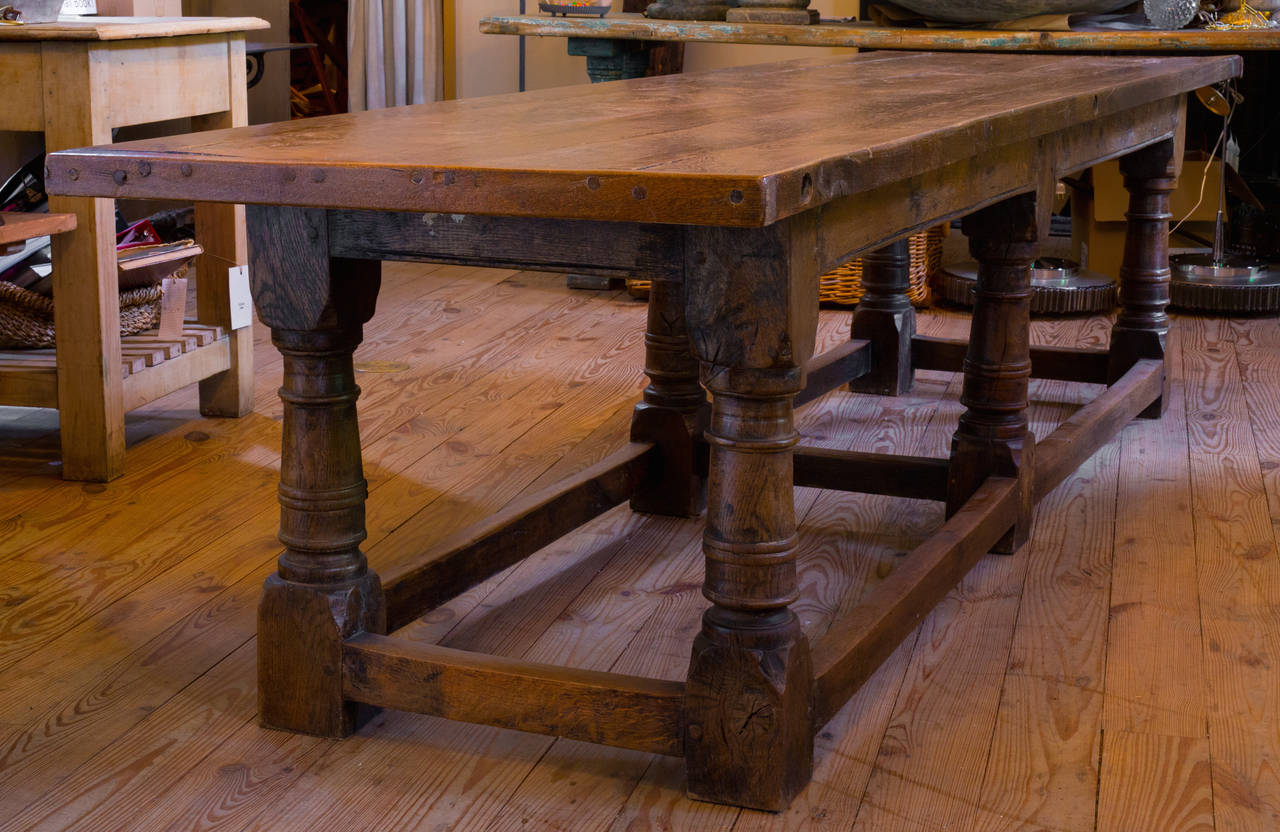 Antique Oak table from Belgium, circa 1900.  Would be magnificent in a Great Room or large kitchen. Beautiful carving and patina with wooden pegs and hand-planed top.  Additional photos upon request.