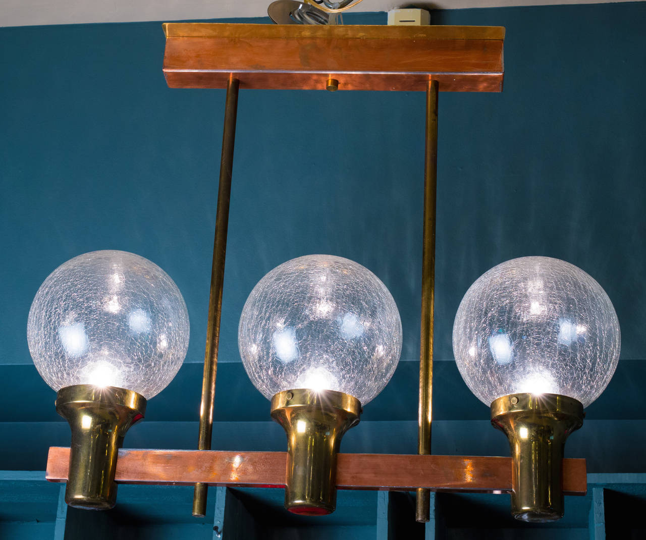 Unusual brass and copper light with original hand-blown crackle glass globes.  Newly rewired in the USA with all UL approved parts and 3 Edison sockets.  Would be great for a small island.