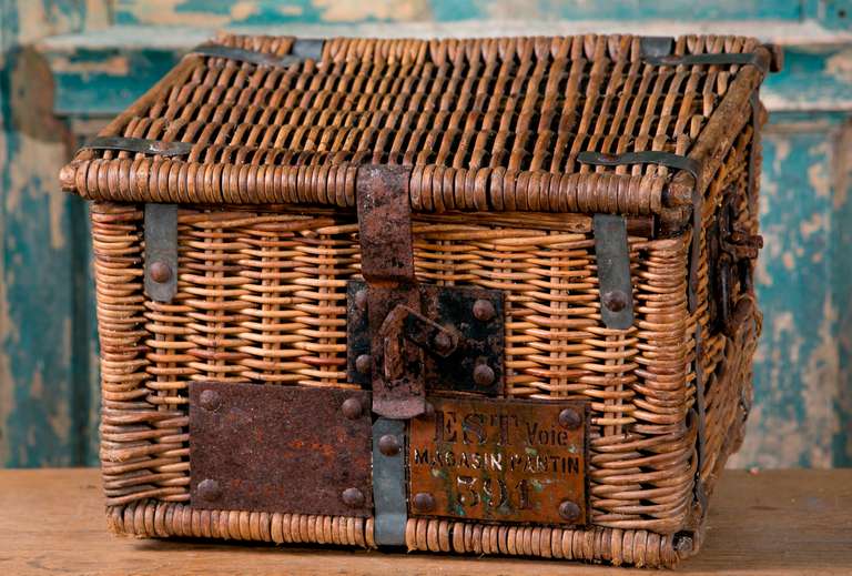Antique locomotive trunk from France. Made from wicker and metal. In good condition. This trunk was used on the railway line between Paris and the Parisian suburb of Pantin. The metal plate identifies the basket of having belonged to a train on the