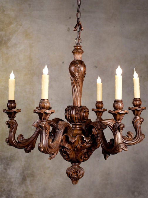 Magnificent and rare, beautifully hand-carved Art Nouveau or Louis XV style wood chandelier from France with a dramatic floral motif. Appears to have stylized Iris shapes in the carvings. In all our years, we've only ever come across one like this. 