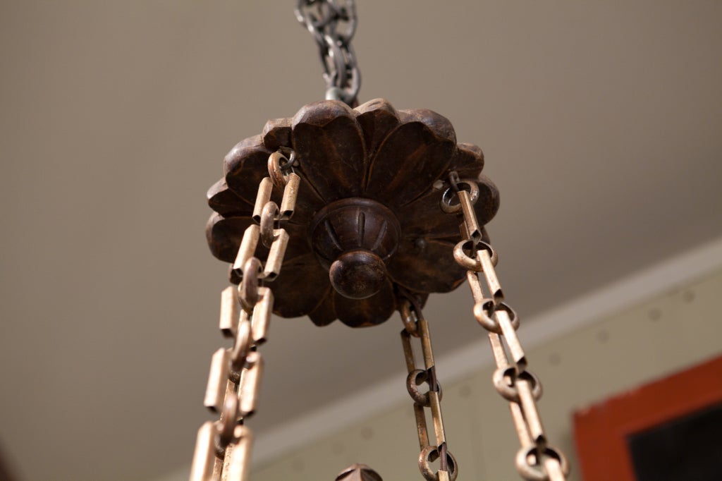 This unusual light has its original chain and canopy and has wonderful carvings. It has various trefoils, etc.  Hand-carved.