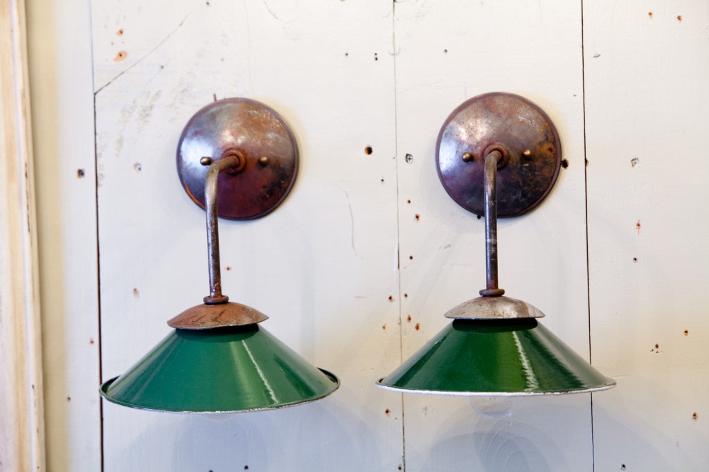 Vintage iron and enamel shades on handmade steel sconces. Price is for a single sconce.  Multiples available.