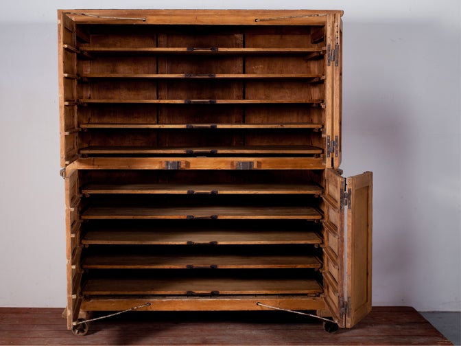 20th Century Rustic cupboard from a bakery with original wheels